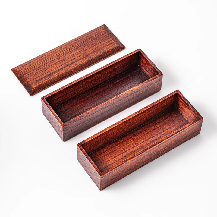 Rectangular two-tier bento box crafted from dark brown paulownia wood, showcasing a sleek grain pattern and a seamless, minimalist design.









