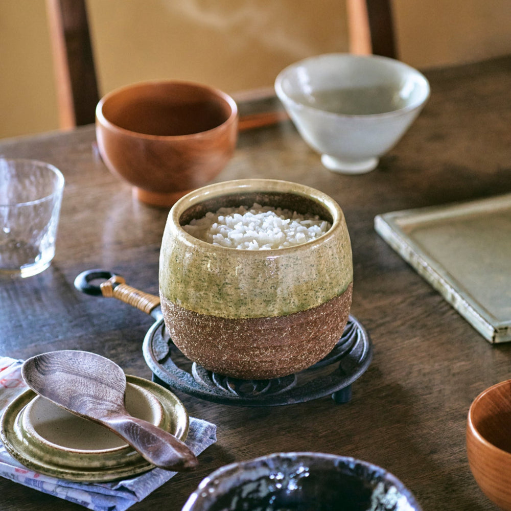 Two-Tone Ceramic Rice Storage Bowl for Cooked Rice (Ohitsu), serving freshly steamed rice at the table in authentic Japanese style.