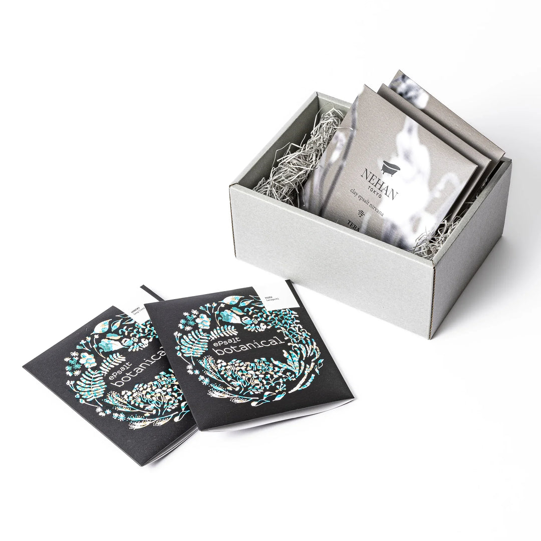 Assorted NEHAN TOKYO bath salt gift set featuring epsalt botanical and clay epsalt nirvana in an elegant grey box