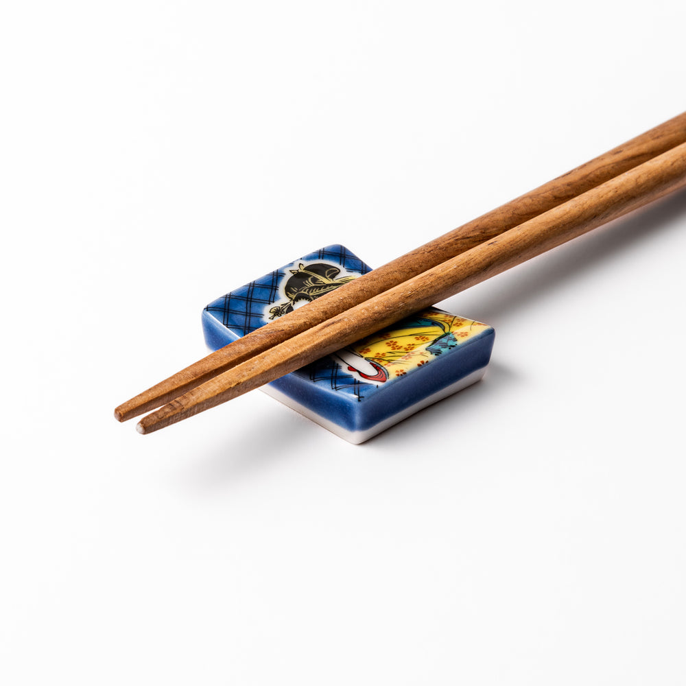 Rectangular Japanese ceramic chopstick rest featuring an elegant courtesan in traditional kimono, inspired by Utamaro’s ukiyo-e artistry, perfect for table decor.