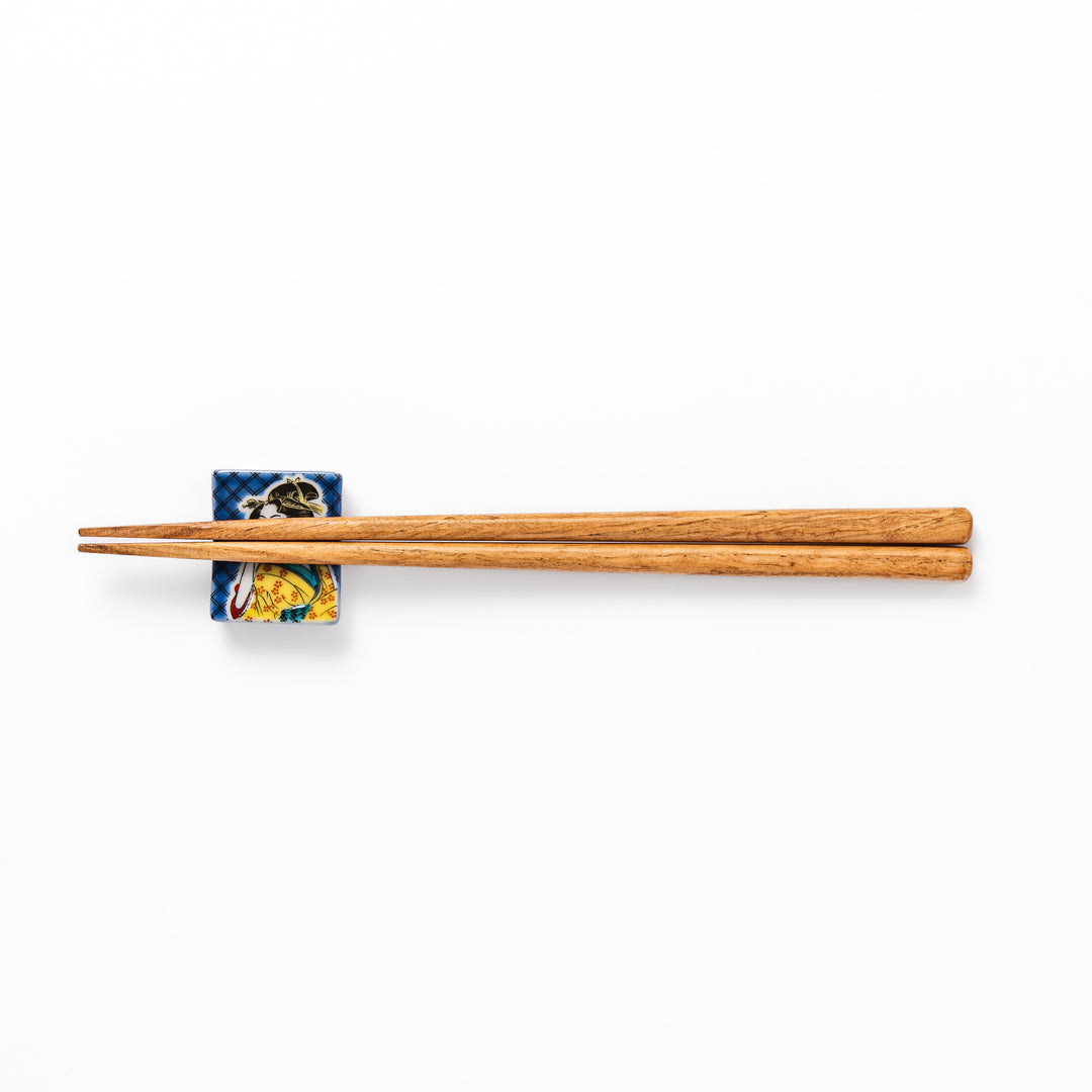 Rectangular Japanese ceramic chopstick rest featuring an elegant courtesan in traditional kimono, inspired by Utamaro’s ukiyo-e artistry, perfect for table decor.
