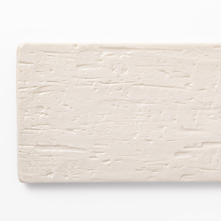 Textured rectangular white ceramic serving plate with a woodgrain-like pattern, perfect for minimalist Japanese table settings or modern kitchens.