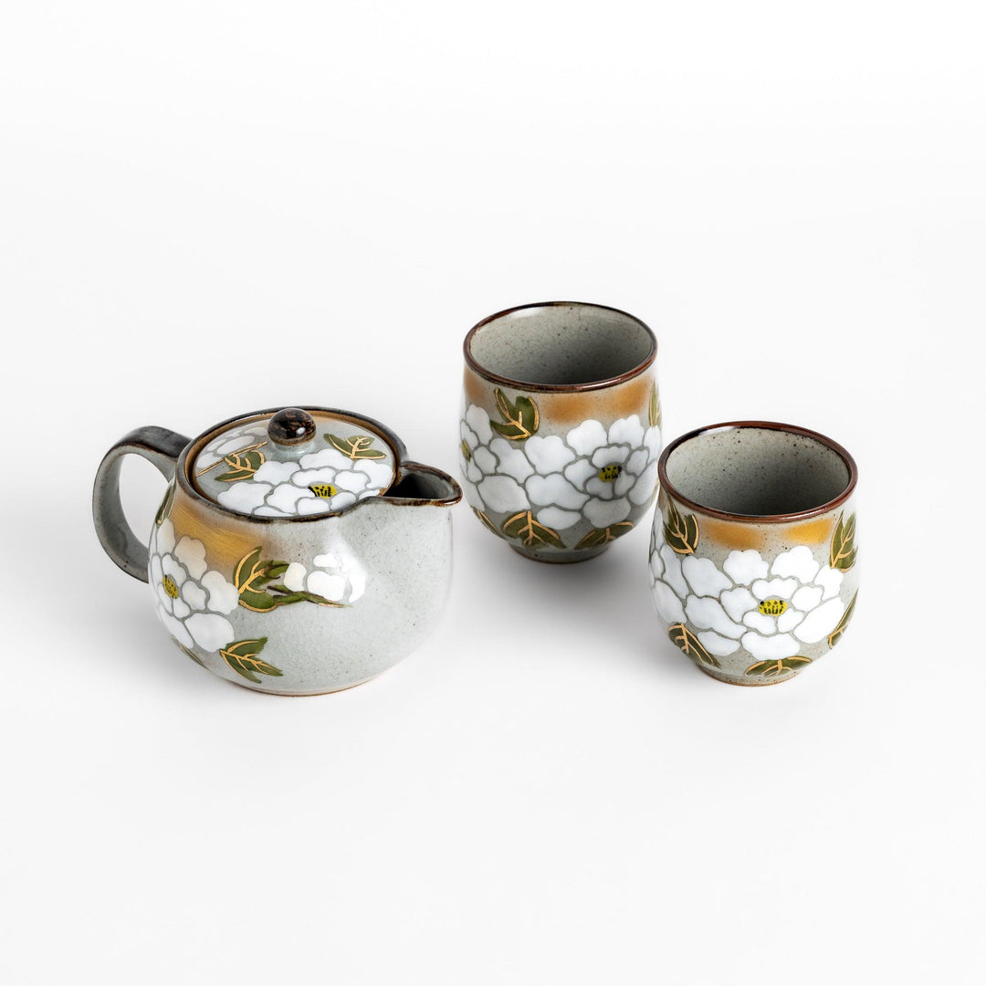 Elegant tea set featuring a white peony design, complete with a teapot and two matching cups, perfect for a serene tea experience.