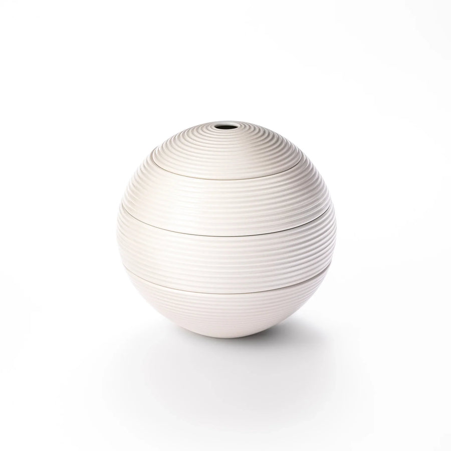 White porcelain moon shaped jubako box with textured ridged surface