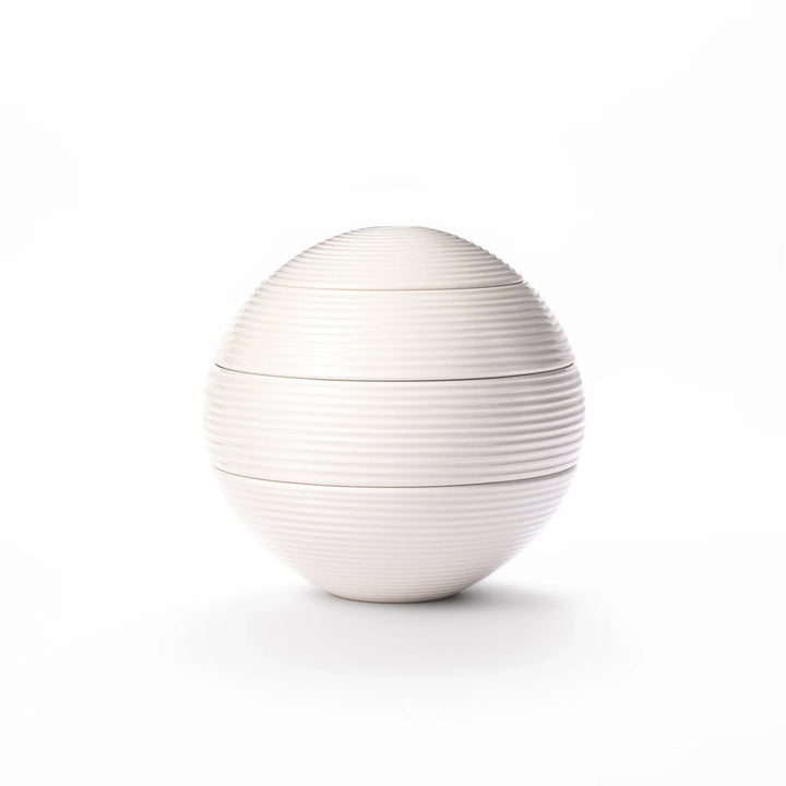 White porcelain moon shaped jubako box with textured ridged surface