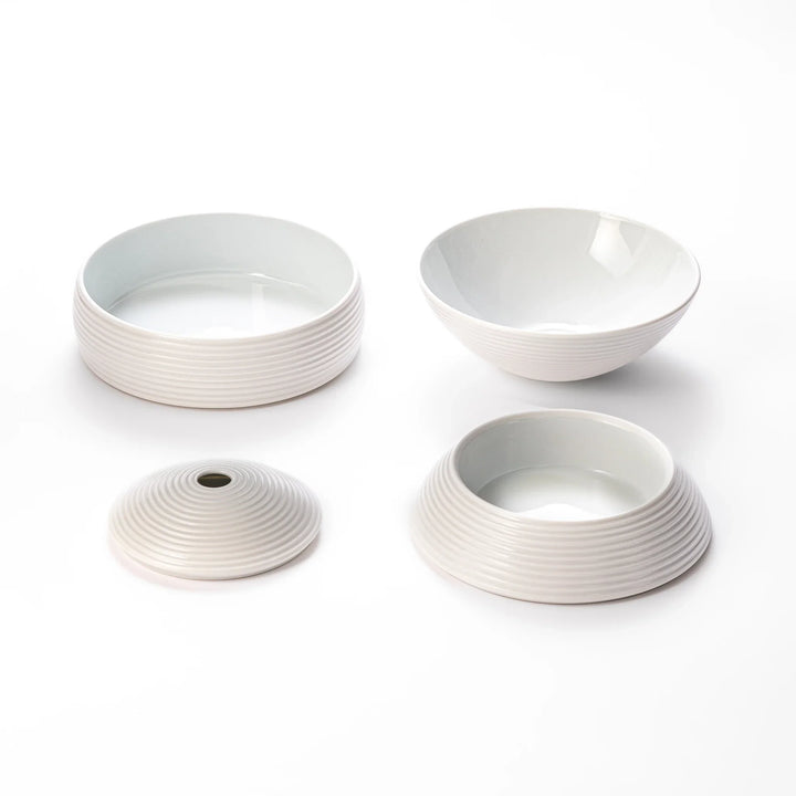 White porcelain moon shaped jubako box with textured ridged surface