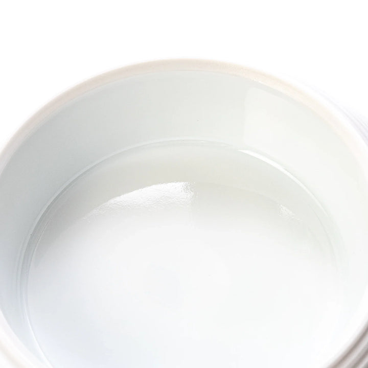 White porcelain moon shaped jubako box with textured ridged surface