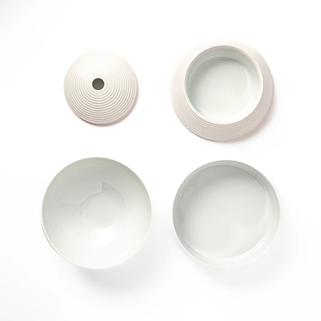 White porcelain moon shaped jubako box with textured ridged surface