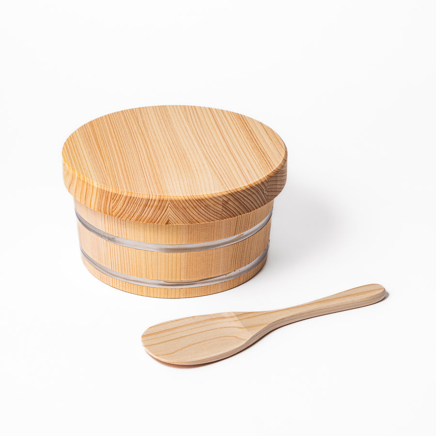 Wooden rice container with lid and paddle, made from natural wood with metal bands, ideal for storing and serving freshly cooked rice.