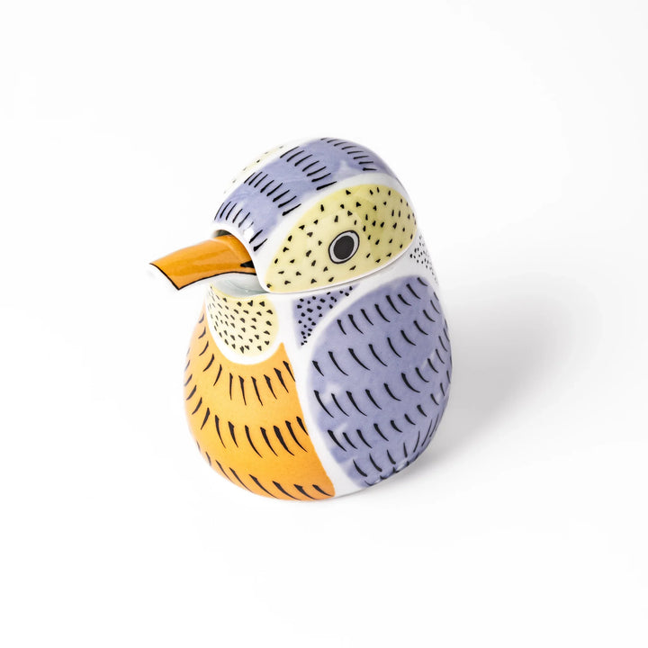 Bird-shaped soy sauce dispenser with purple and yellow hand-painted details, adding a playful touch to your table.
