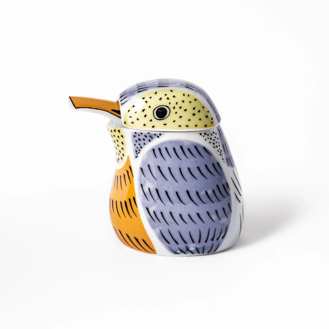 Bird-shaped soy sauce dispenser with purple and yellow hand-painted details, adding a playful touch to your table.