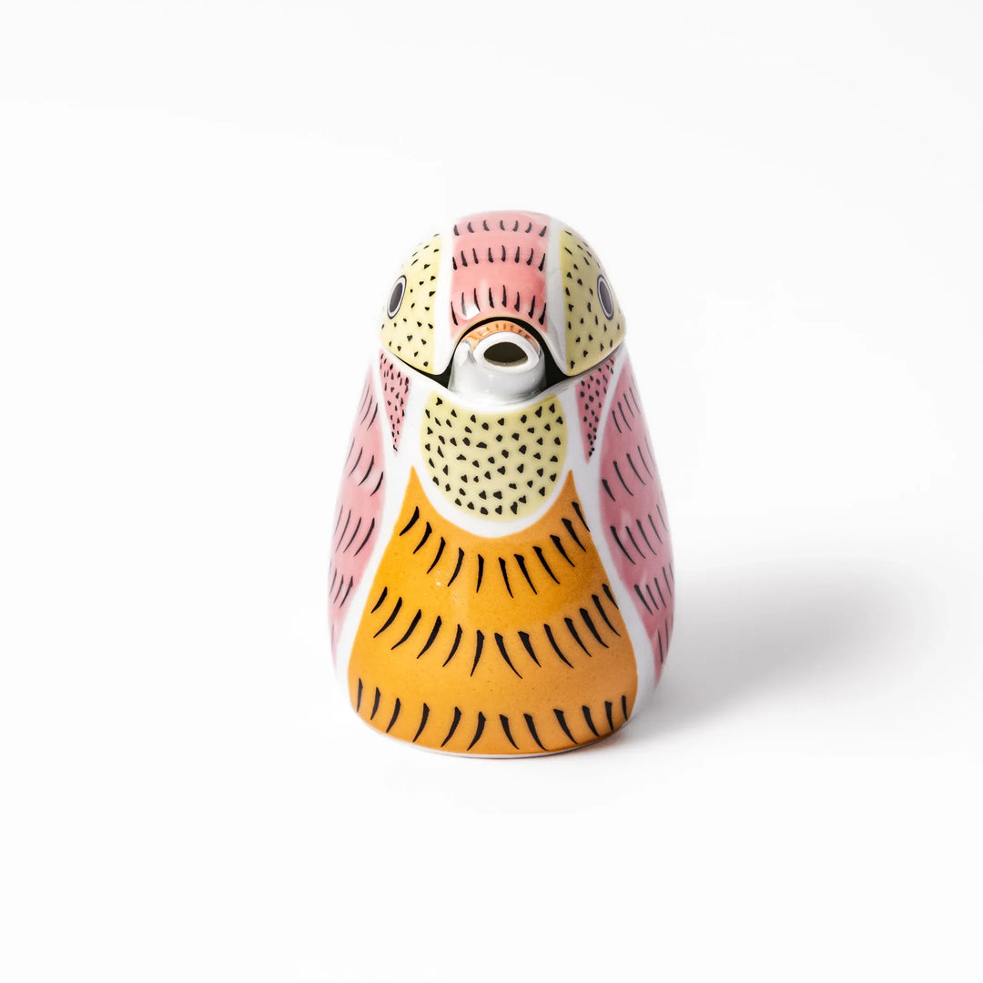 Bird-shaped soy sauce dispenser with pink and yellow hand-painted details, adding a playful touch to your table.