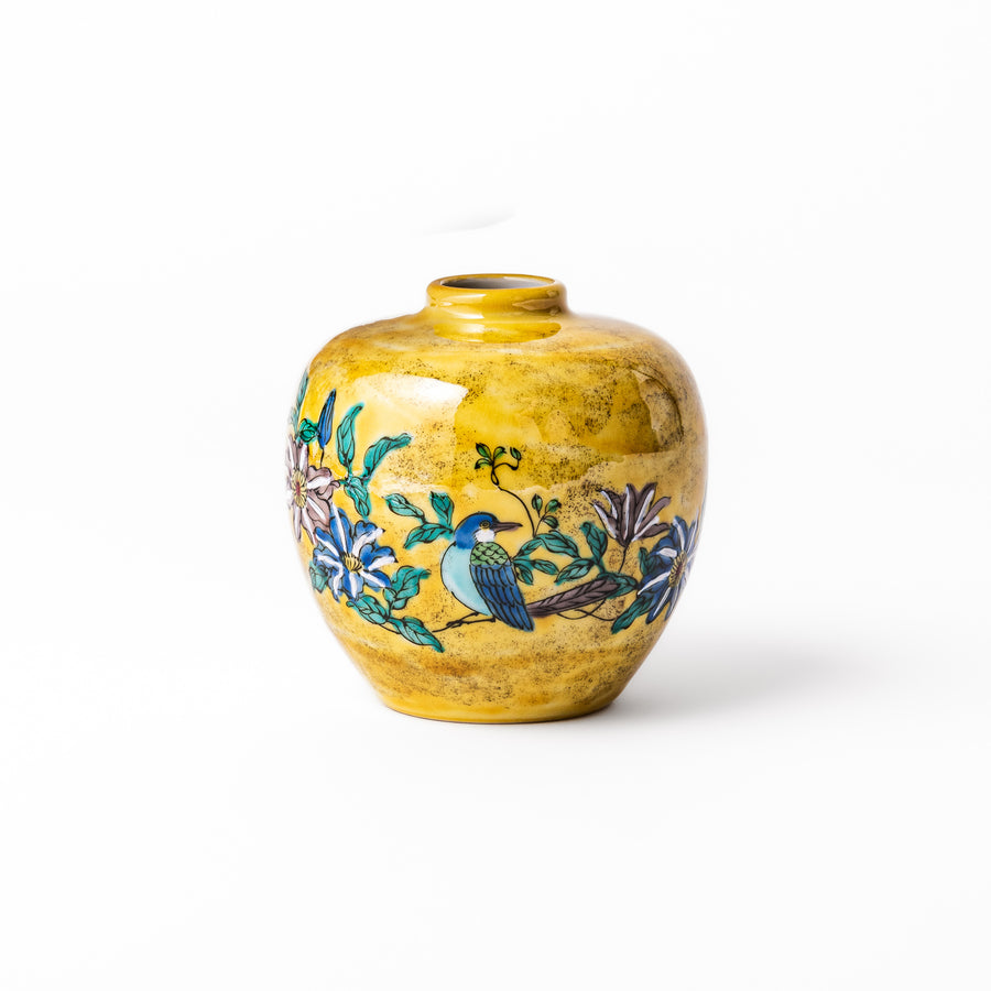 Japanese yellow porcelain bud vase with hand-painted camellia flowers and bird motif, handcrafted in Kutani ware for elegant floral display.