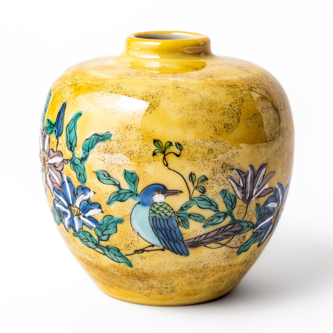 Japanese yellow porcelain bud vase with hand-painted camellia flowers and bird motif, handcrafted in Kutani ware for elegant floral display.