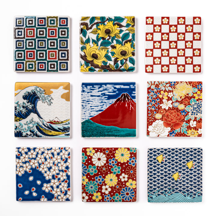 Set of Japanese ceramic coasters featuring traditional patterns like waves, Mt. Fuji, cherry blossoms, and floral motifs, perfect for elegant table settings.