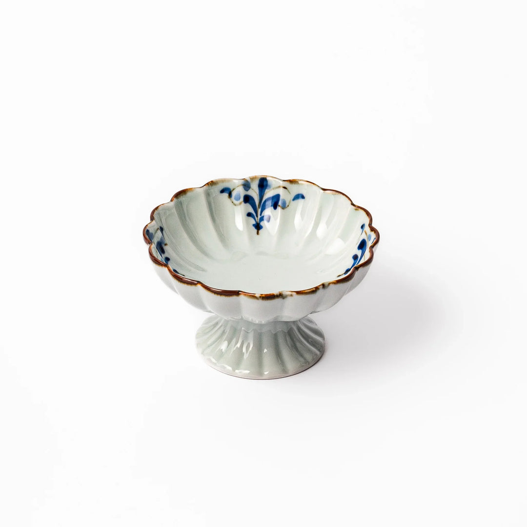 Arita porcelain pedestal bowl with blue arabesque pattern and gold rim, perfect for serving desserts, fruits, or side dishes.