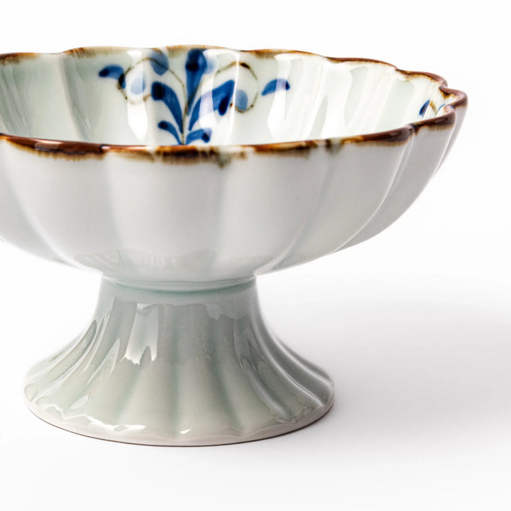 Arita porcelain pedestal bowl with blue arabesque pattern and gold rim, perfect for serving desserts, fruits, or side dishes.