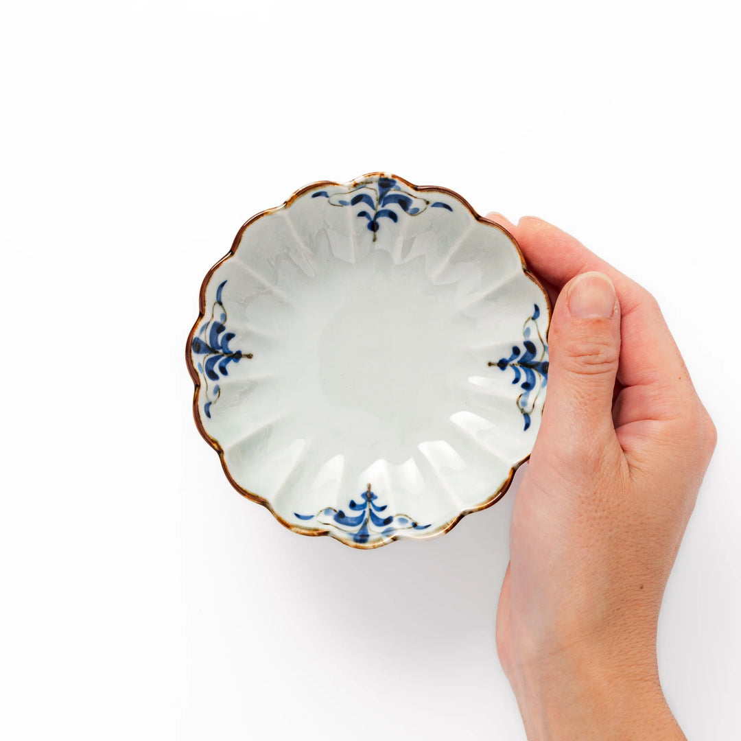 Arita porcelain pedestal bowl with blue arabesque pattern and gold rim, perfect for serving desserts, fruits, or side dishes.