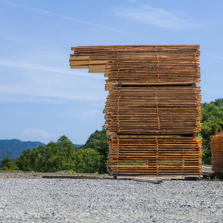 Air drying stacks of Japanese hinoki boards prepared for crafting traditional kitchenware