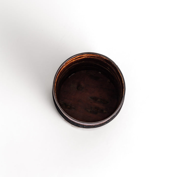 Elegant cherry bark tea caddy with mother-of-pearl cherry blossom inlay, perfect for storing and preserving fine tea leaves.