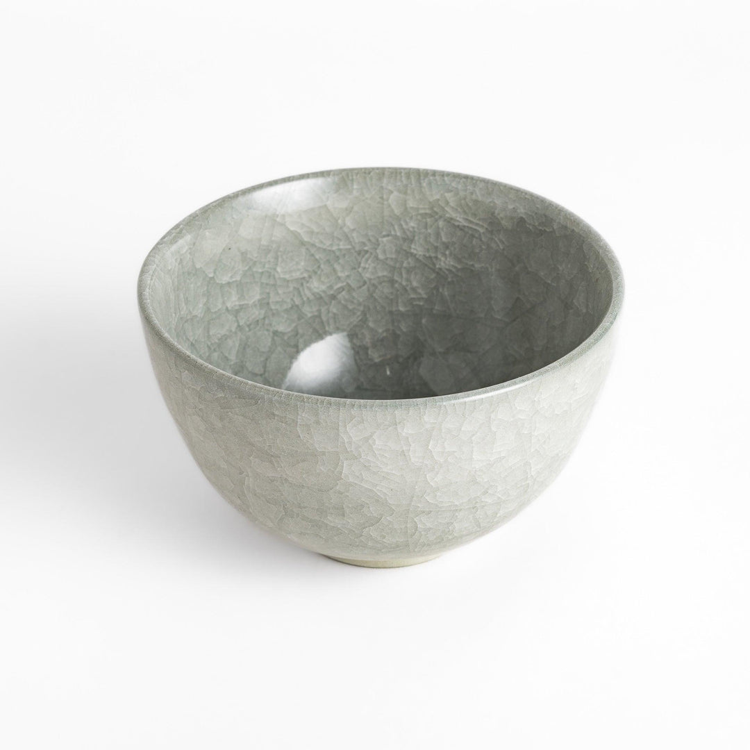 Azure clay matcha bowl with a smooth, cracked texture, perfect for enjoying matcha, offering a calming and elegant design for tea time.