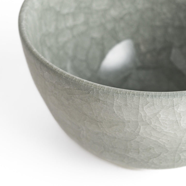 Azure clay matcha bowl with a smooth, cracked texture, perfect for enjoying matcha, offering a calming and elegant design for tea time.
