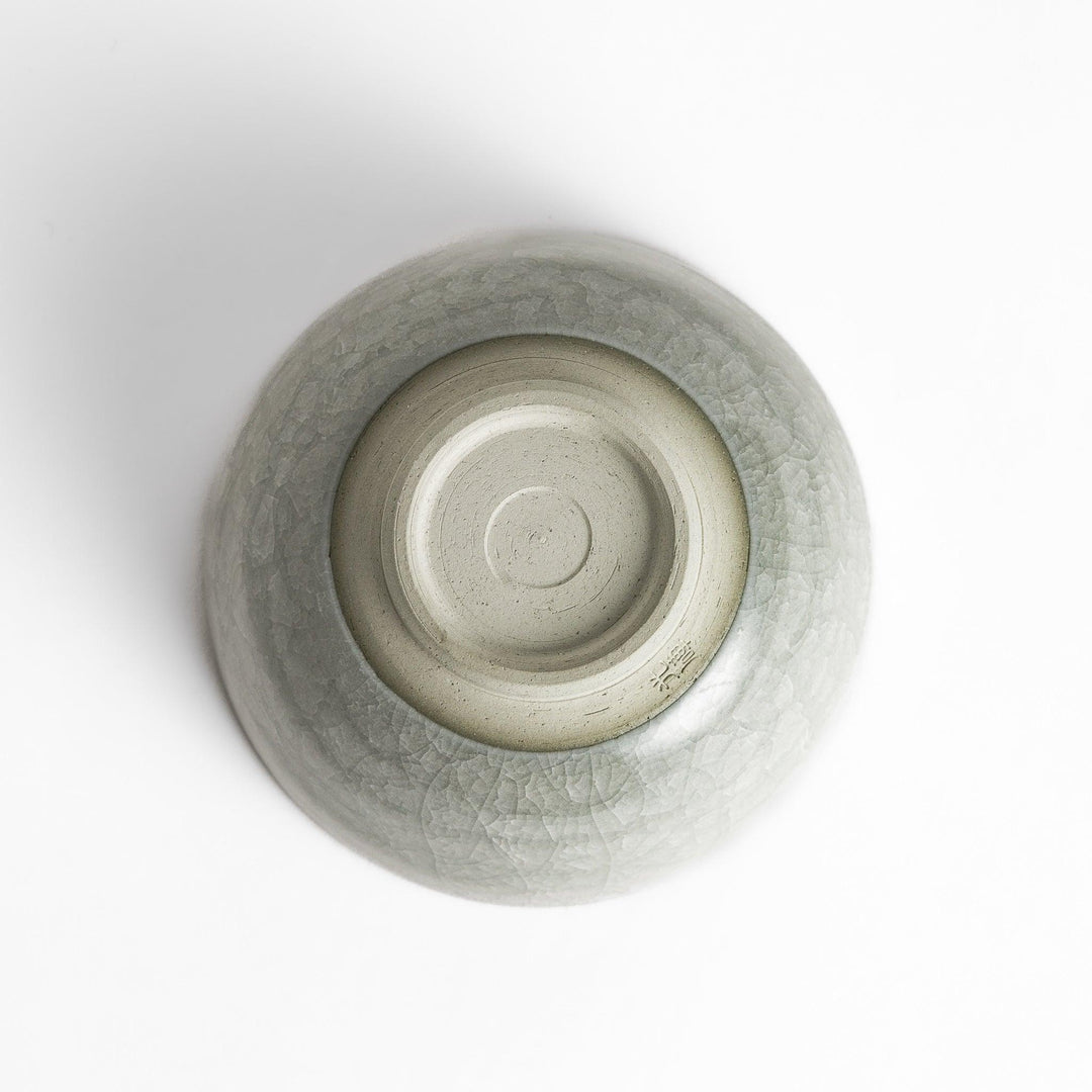 Azure clay matcha bowl with a smooth, cracked texture, perfect for enjoying matcha, offering a calming and elegant design for tea time.