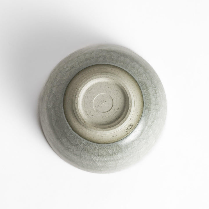 Azure clay matcha bowl with a smooth, cracked texture, perfect for enjoying matcha, offering a calming and elegant design for tea time.