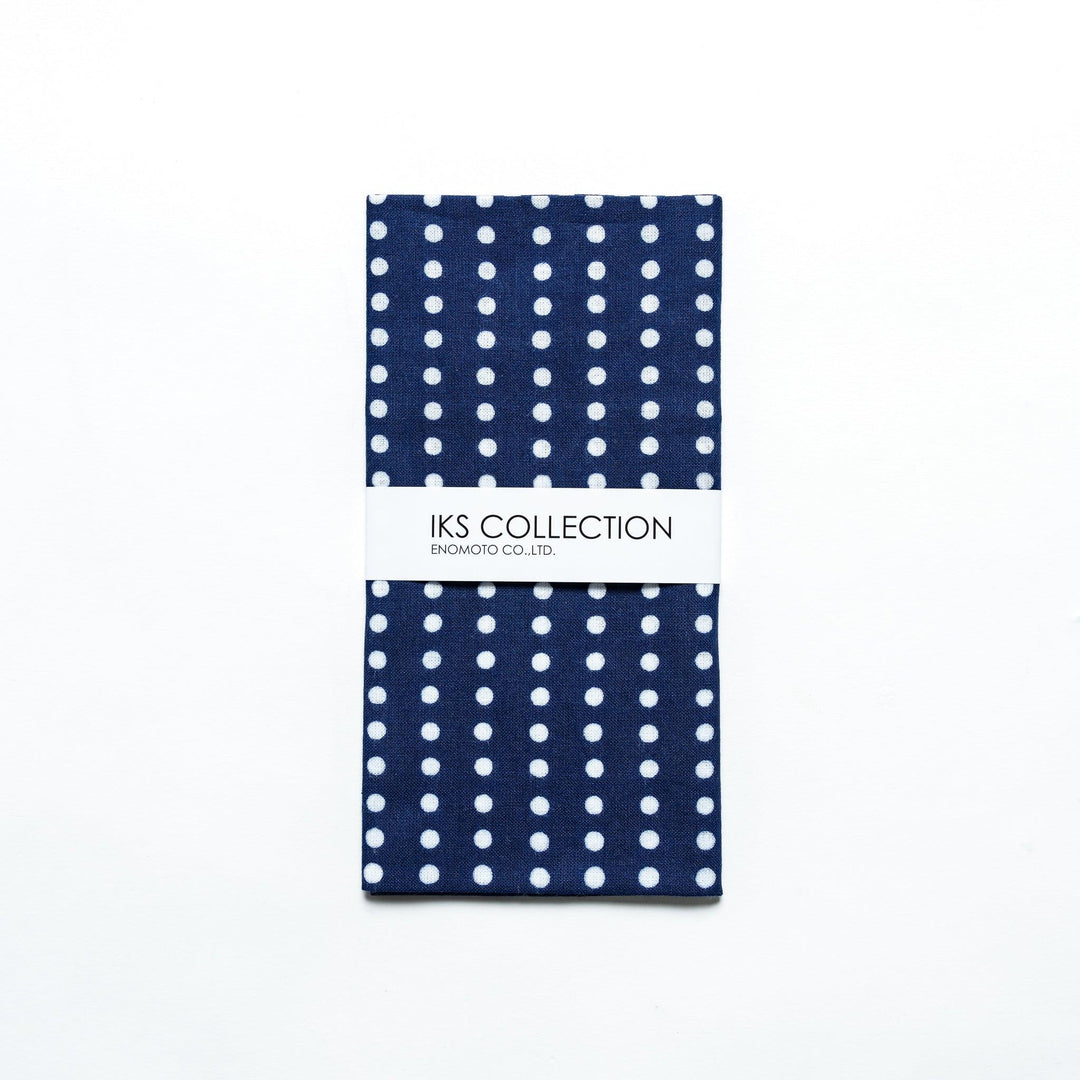 Navy tenugui folded neatly, with a product sleeve for display.