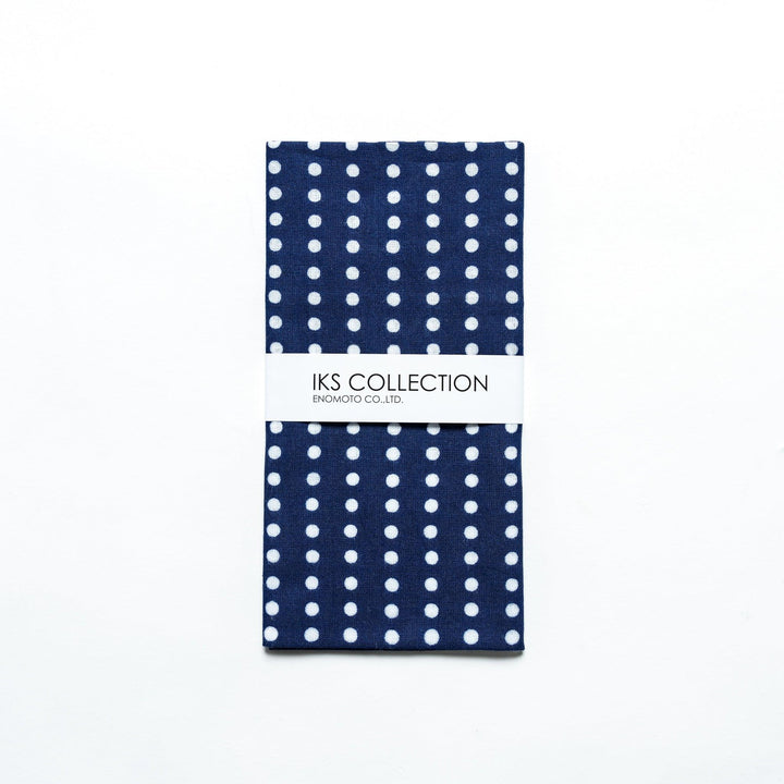 Navy tenugui folded neatly, with a product sleeve for display.