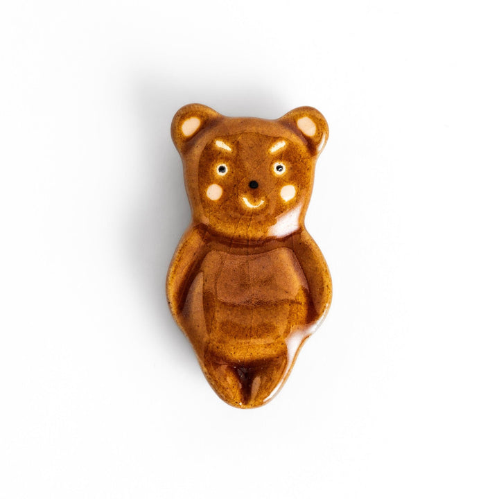 Bear-shaped chopstick rest, featuring a cute smiling face and playful design.