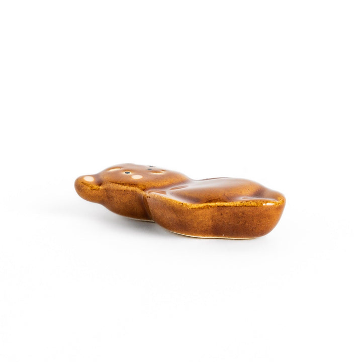 Bear-shaped chopstick rest, featuring a cute smiling face and playful design.