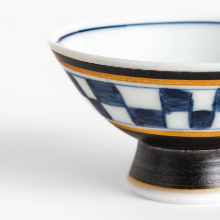 Elegant Japanese Sake Cup featuring a black and white checkered design, perfect for enjoying your favorite sake. 