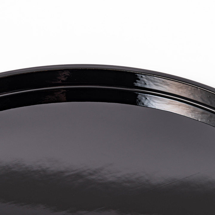 Glossy black Japanese round wooden tray with raised rim, ideal for serving tea or displaying tableware with a refined and minimalist aesthetic.