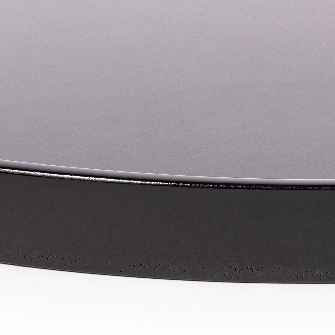 Glossy black Japanese round wooden tray with raised rim, ideal for serving tea or displaying tableware with a refined and minimalist aesthetic.