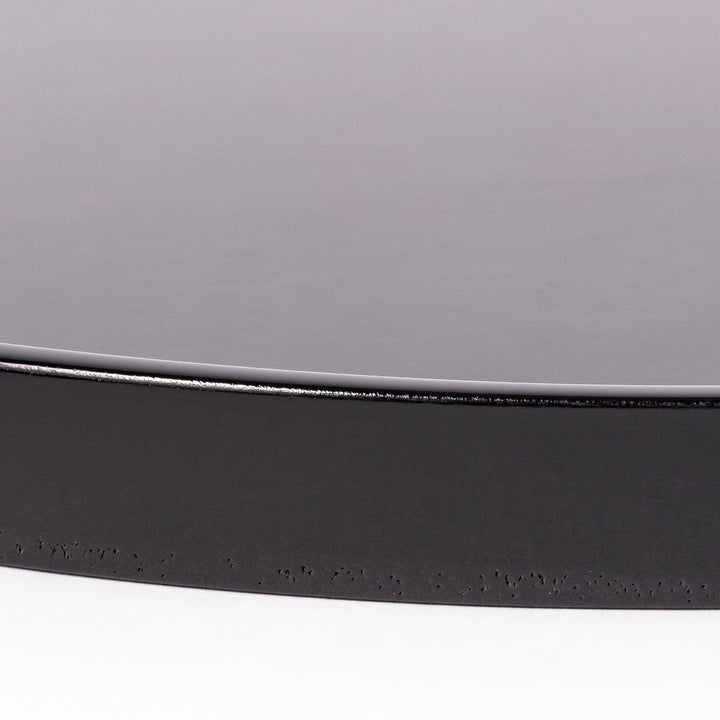 Glossy black Japanese round wooden tray with raised rim, ideal for serving tea or displaying tableware with a refined and minimalist aesthetic.