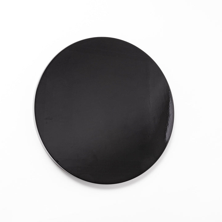 Glossy black Japanese round wooden tray with raised rim, ideal for serving tea or displaying tableware with a refined and minimalist aesthetic.
