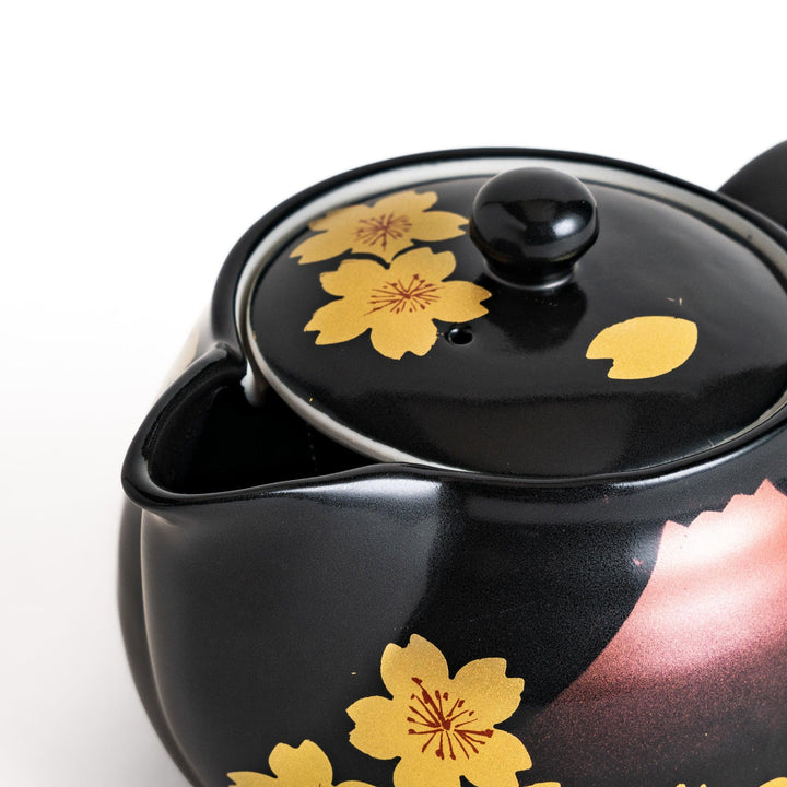 Black teapot with red Mount Fuji and yellow sakura designs, showcasing its elegant Japanese aesthetic and cultural charm.