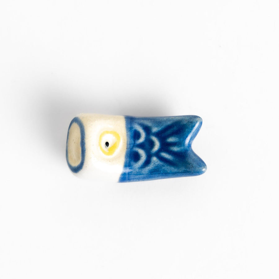 Ceramic chopstick rest shaped like a blue carp streamer, featuring hand-painted details and a charming traditional Japanese festive design.