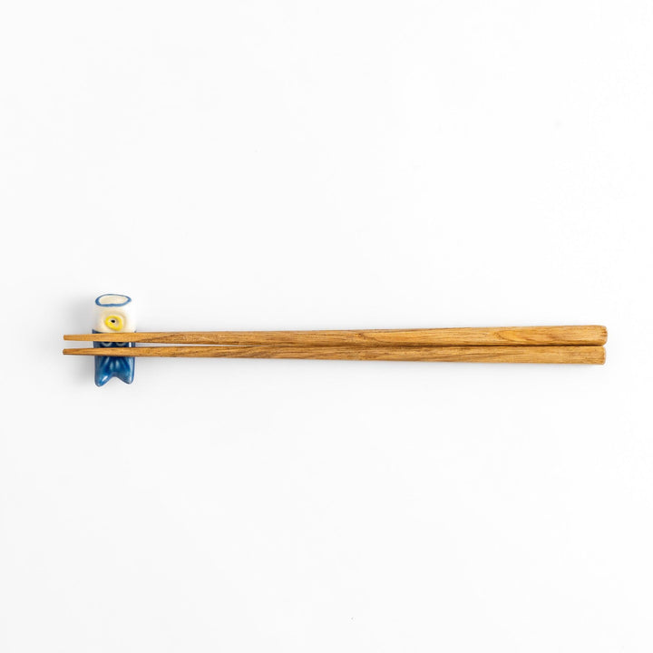 Ceramic chopstick rest shaped like a blue carp streamer, featuring hand-painted details and a charming traditional Japanese festive design.