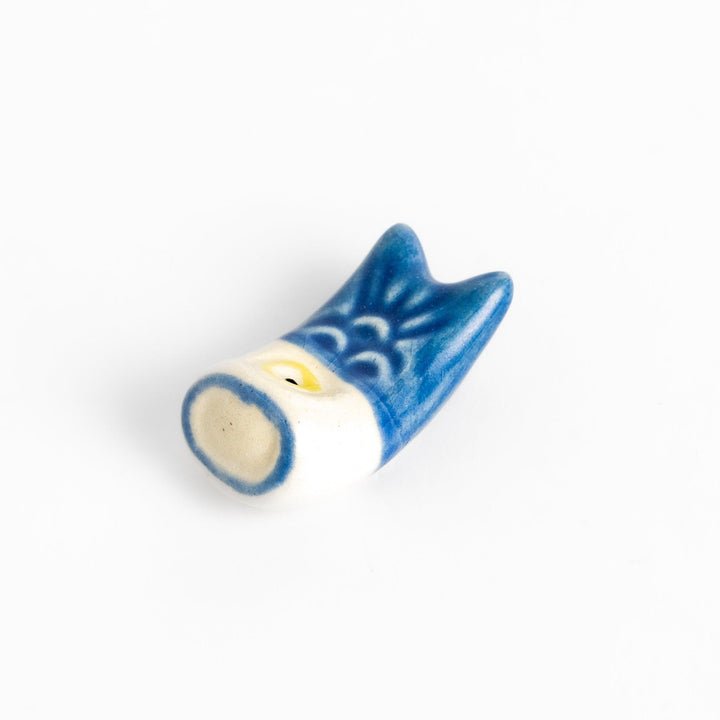 Ceramic chopstick rest shaped like a blue carp streamer, featuring hand-painted details and a charming traditional Japanese festive design.