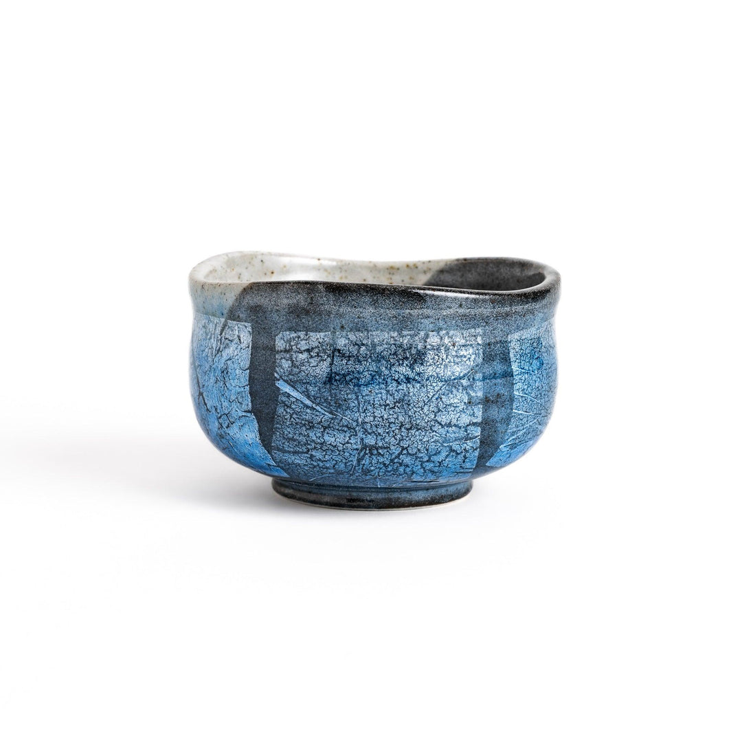Unique blue matcha bowl with a reactive glaze and crackle effect, perfect for whisking and savoring a traditional bowl of matcha.