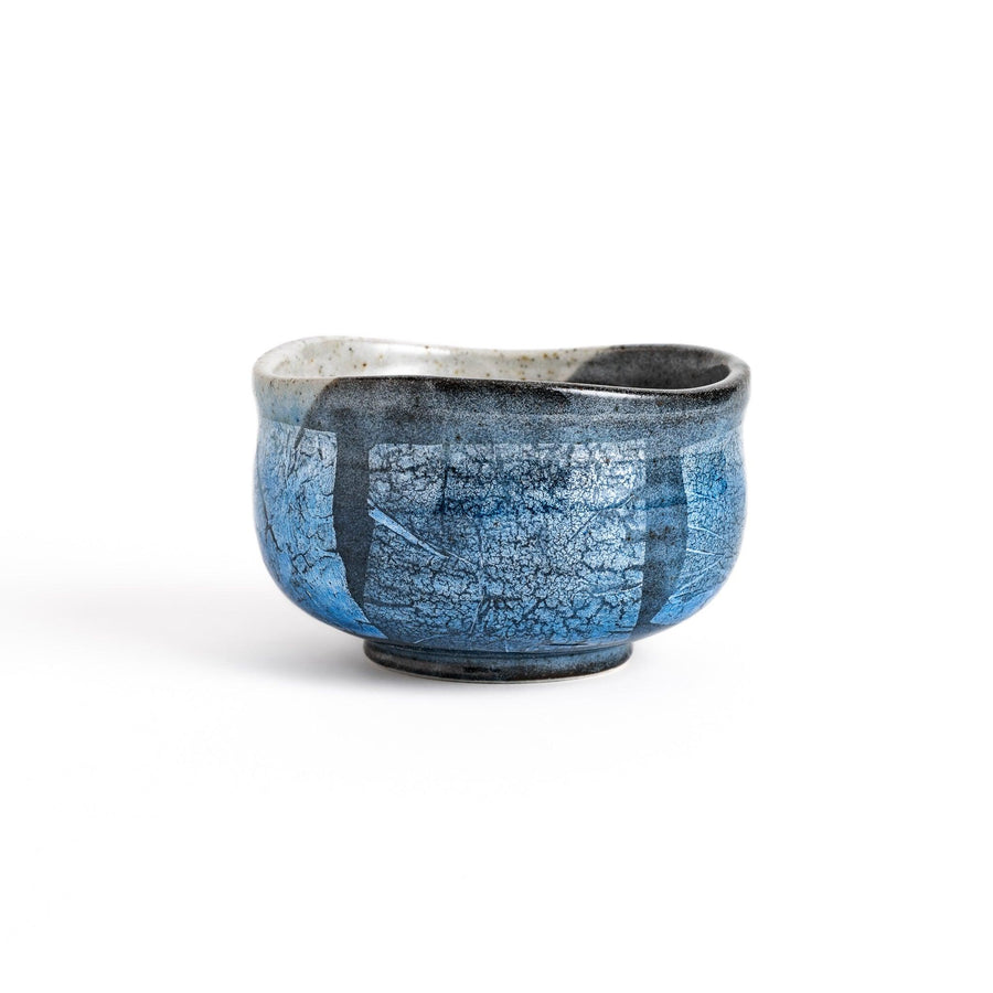 Unique blue matcha bowl with a reactive glaze and crackle effect, perfect for whisking and savoring a traditional bowl of matcha.