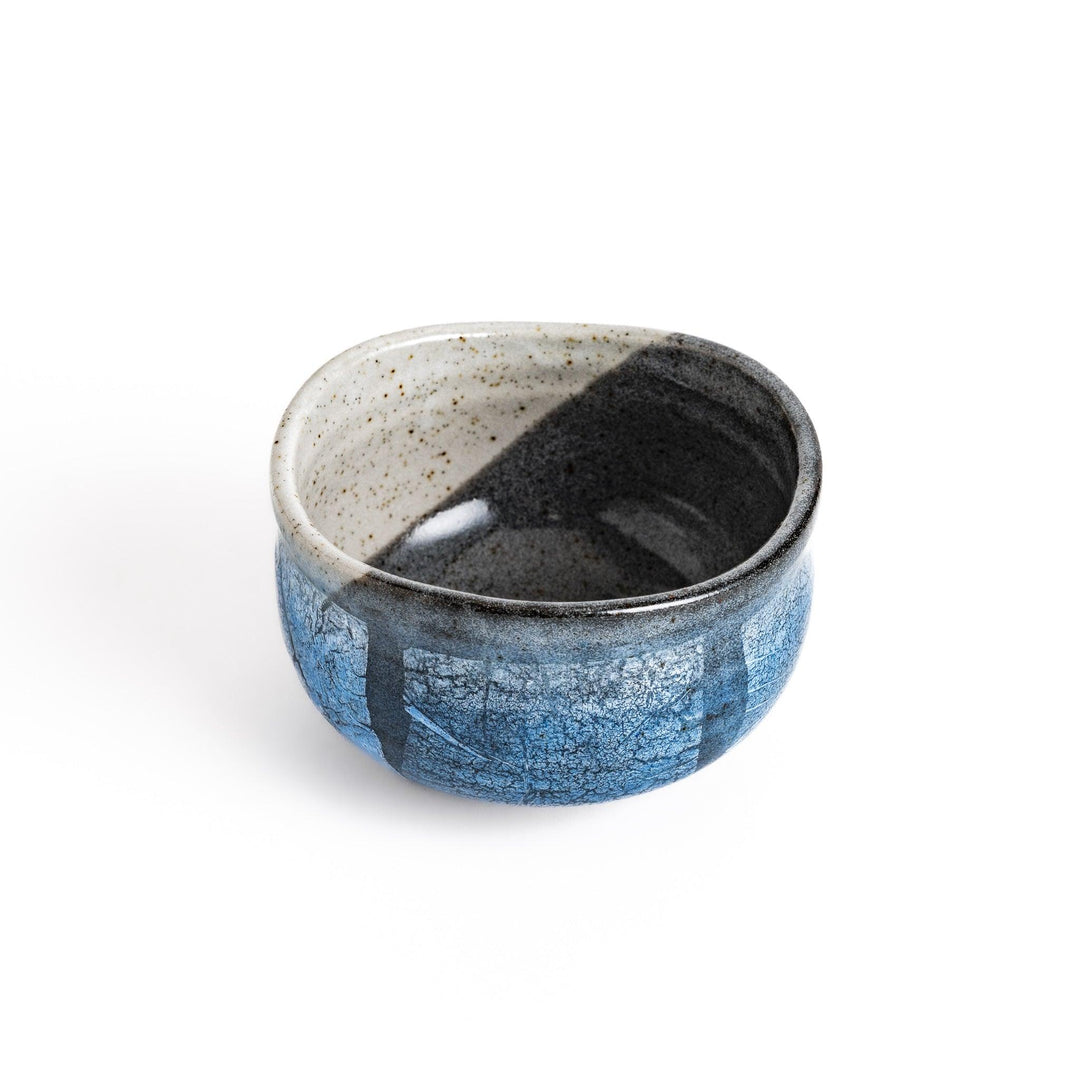 Unique blue matcha bowl with a reactive glaze and crackle effect, perfect for whisking and savoring a traditional bowl of matcha.