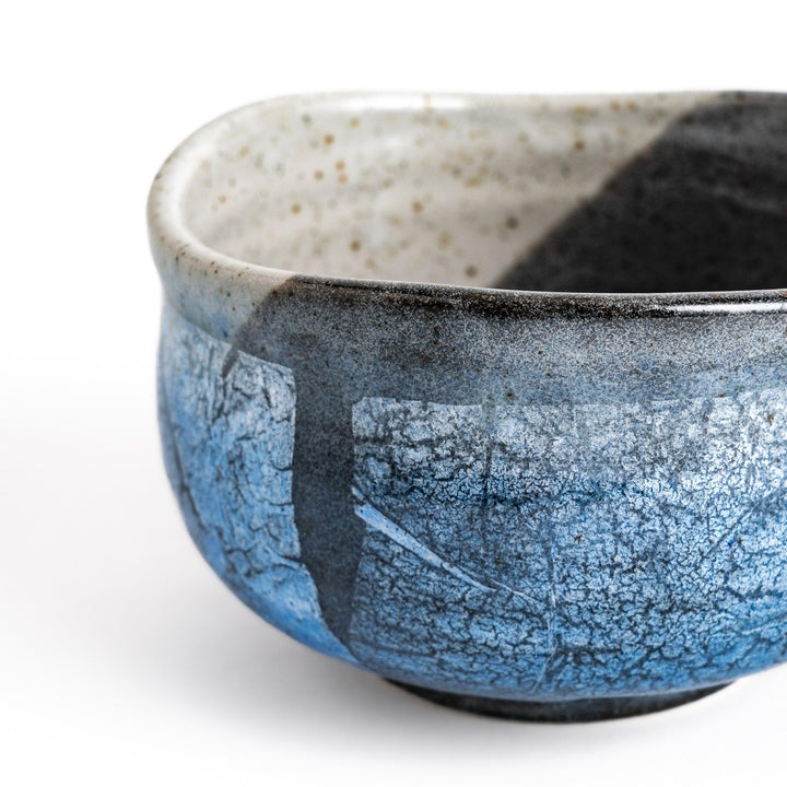 Unique blue matcha bowl with a reactive glaze and crackle effect, perfect for whisking and savoring a traditional bowl of matcha.