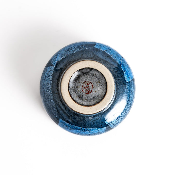 Unique blue matcha bowl with a reactive glaze and crackle effect, perfect for whisking and savoring a traditional bowl of matcha.