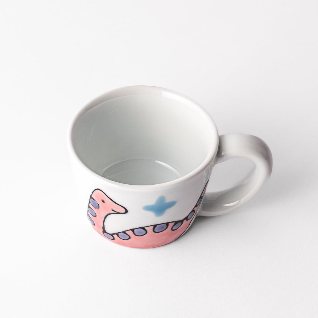 Kids' mug with a playful pink Brachiosaurus design, featuring purple spots and blue accents, perfect for adding a fun touch to your child's mealtime.