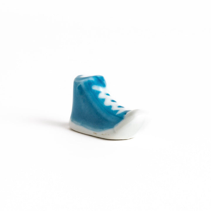 Light Blue Canvas Sneaker Chopstick Rest with white laces and a detailed high-top design, adding a playful touch to your table setting.