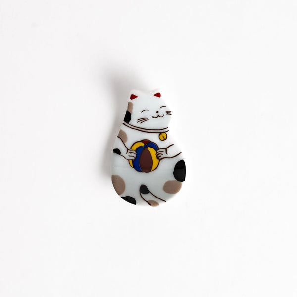 Cat Holding Ball Chopstick Rest