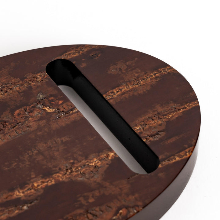 Oval-shaped cherry bark teapot rest with a beautiful natural grain and a delicate cherry blossom inlay, adding a touch of elegance to your tea time.